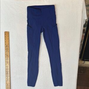 blue Lululemon Fast and Free High-Rise Tights featuring side pockets